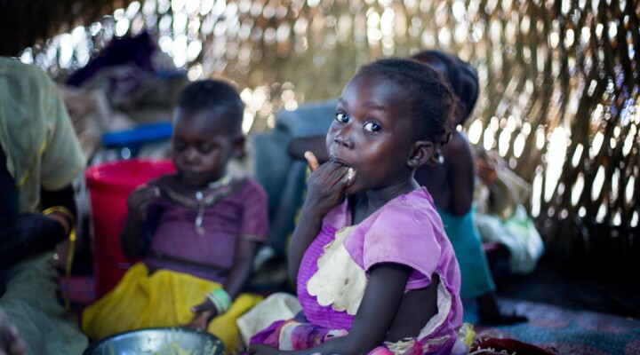  Katna Arkangelo is enjoying the porridge her mother has prepared after the food distribution from the ICRC. She is one of eight siblings who are sharing the food. ?The food we have been given from the ICRC is good, but it is not enough?, her mother Dorina says. CC BY-NC-ND / ICRC / Mari Aftret Mortvedt 