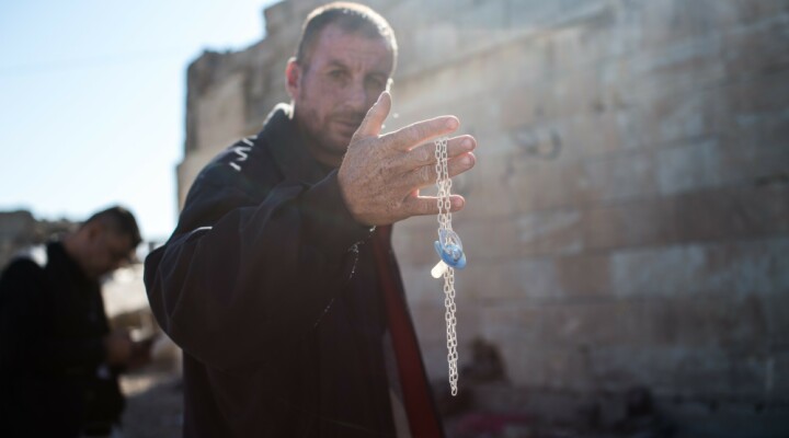 Man holding baby''s pacifier