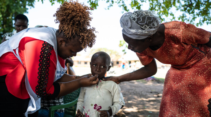 A young girl displaced by flooding is given medicine at a pop-up medical clinic organized by Kenyan Red Cross in Osodo, Homa Bay, Kenya, Tuesday, Dec 17, 2019. Heavy rains have hit Kenya particularly hard this year, killing crops and displacing tens of thousands of people throughout the country. Mackenzie Knowles-Coursin/ICRC